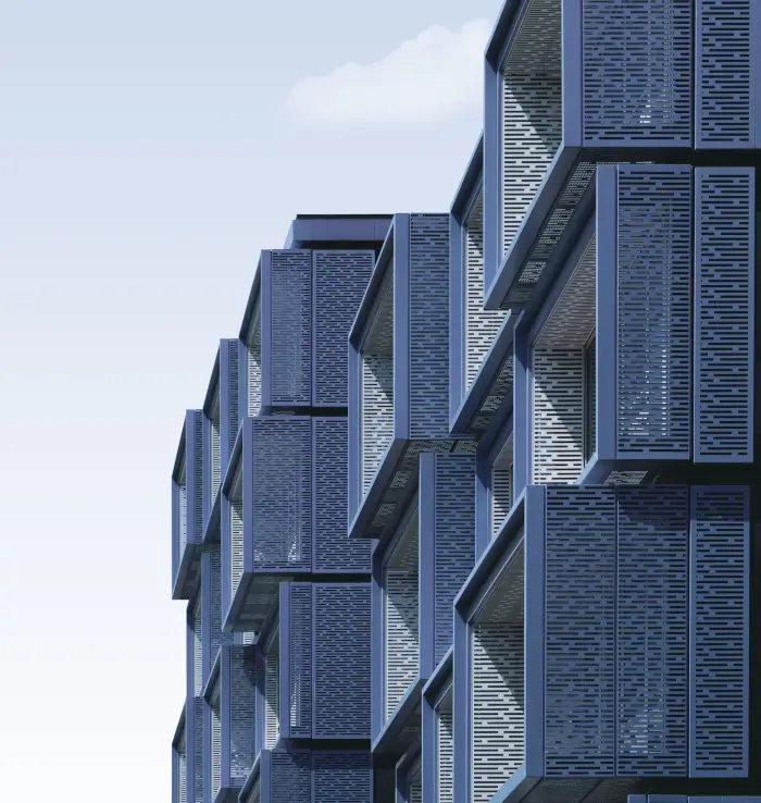 A multi-story building featuring numerous metal balconies on its exterior.
