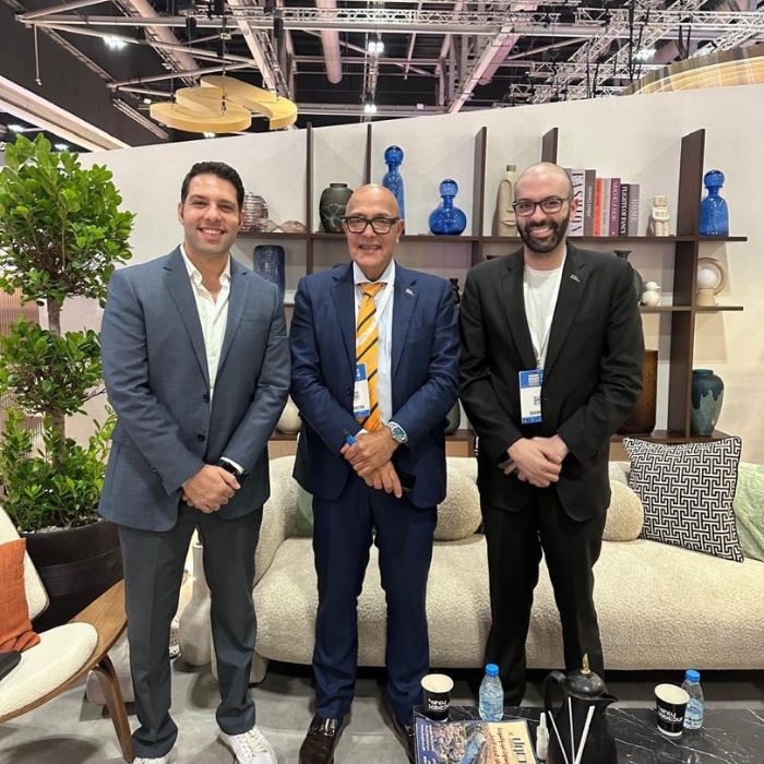Mahmoud Zohny, CEO of ZF Holding, standing with two other men at Oman Design & Build Week 2025 event