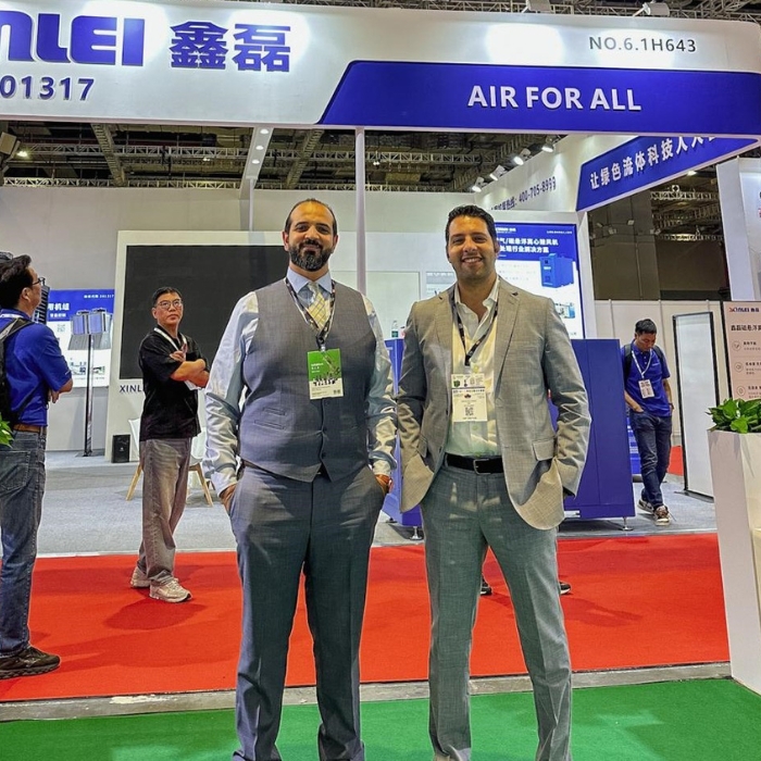 Mahmoud Zohny, CEO of ZF Holding, standing with Super Quality's CEO Ali Al-Shehir at Wei Tec China 2025