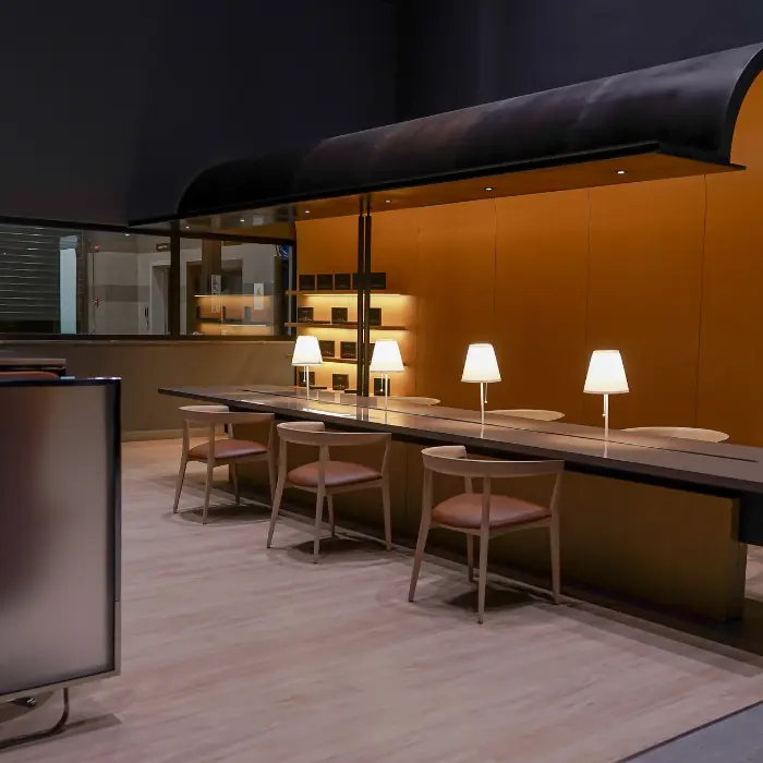 Interior view of the Genesis showroom designed and furnished by SKETCHURE and WOODCHURE, showcasing modern luxury furniture and refined architectural detailing.